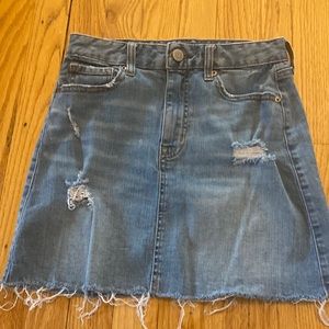 Cute junior denim skirt ripped pair with tshirt, sweater or oversized top!